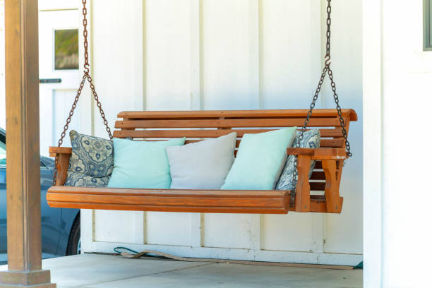 istock Porch swing with comfortable pillows in a patio 1442910297