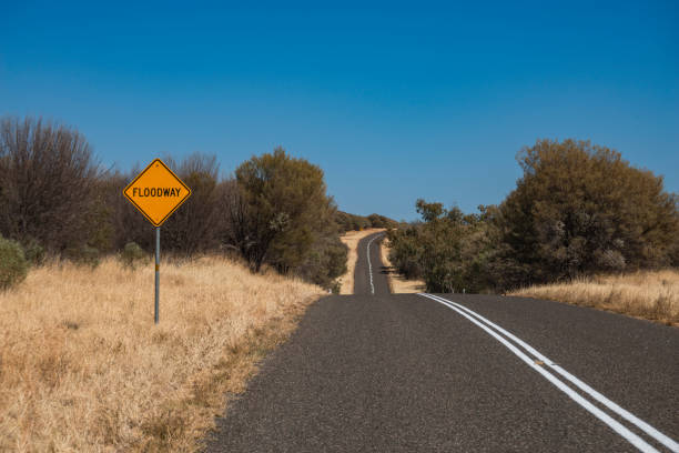 istock Empty road with a sign 