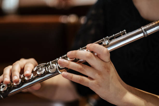 istock Musician playing the flute at a concert 1442910434