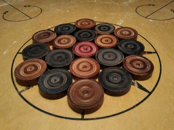 istock A game of carrom with arranged coins on board 1442910464