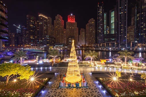 A shiny Christmas evening at the Dubai marina with lights shining from the beautiful tall buildings