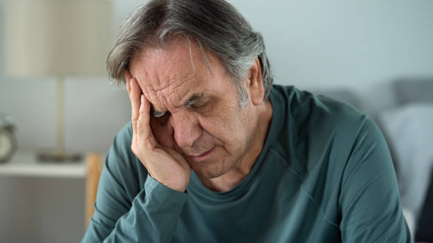istock Portrait of old man with hand on forehead 1442911724