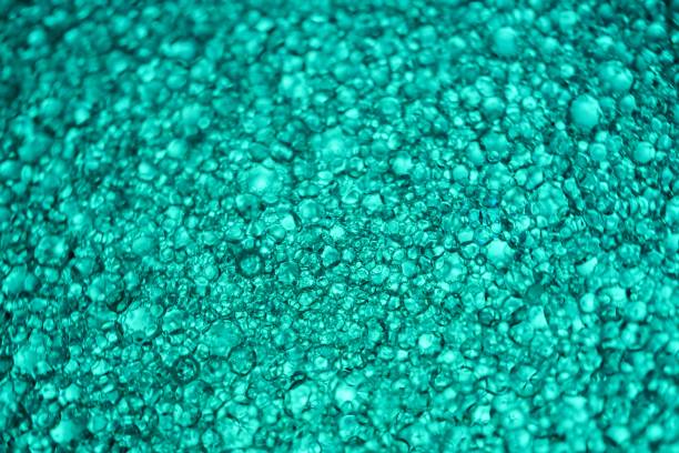 istock abstract blue background of oil drops 1442912253