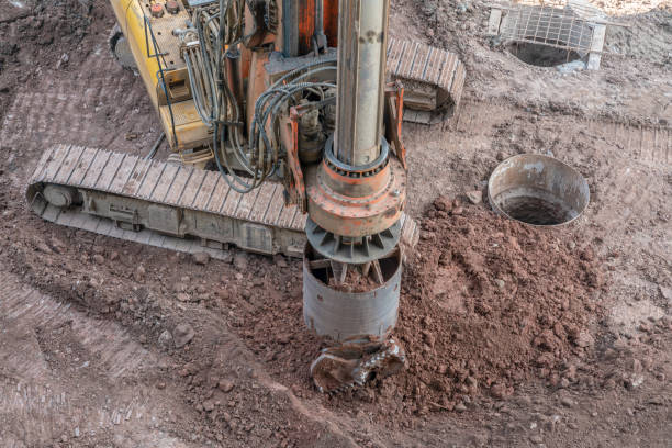 istock Heavy duty pile drilling machine, making a hole in the ground at a construction site 1442912949