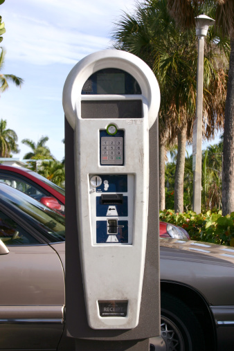 A Parking Meter close famous Naples Pier in Naples, Florida, USA