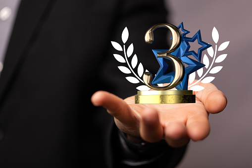 A 3D rendered number 3 presented to a businessman for three years or third place digital award
