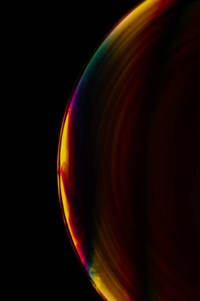 istock Long exposure verticashot of soap bubbles on a black background 1442915930