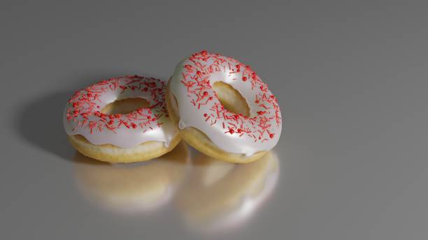 istock Closeup shot of two donuts on a smooth surface 1442915993