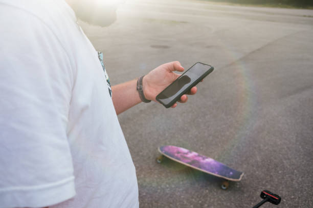 istock Vlogger filming himself for a video with a longboard 1442916251