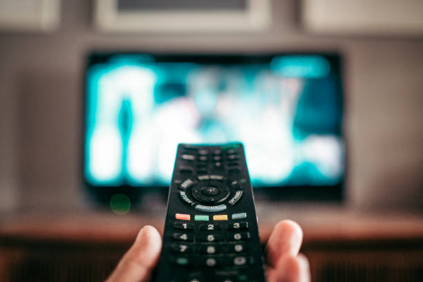 istock Closeup shot of a remote controller for a modern TV in a hand 1442916347