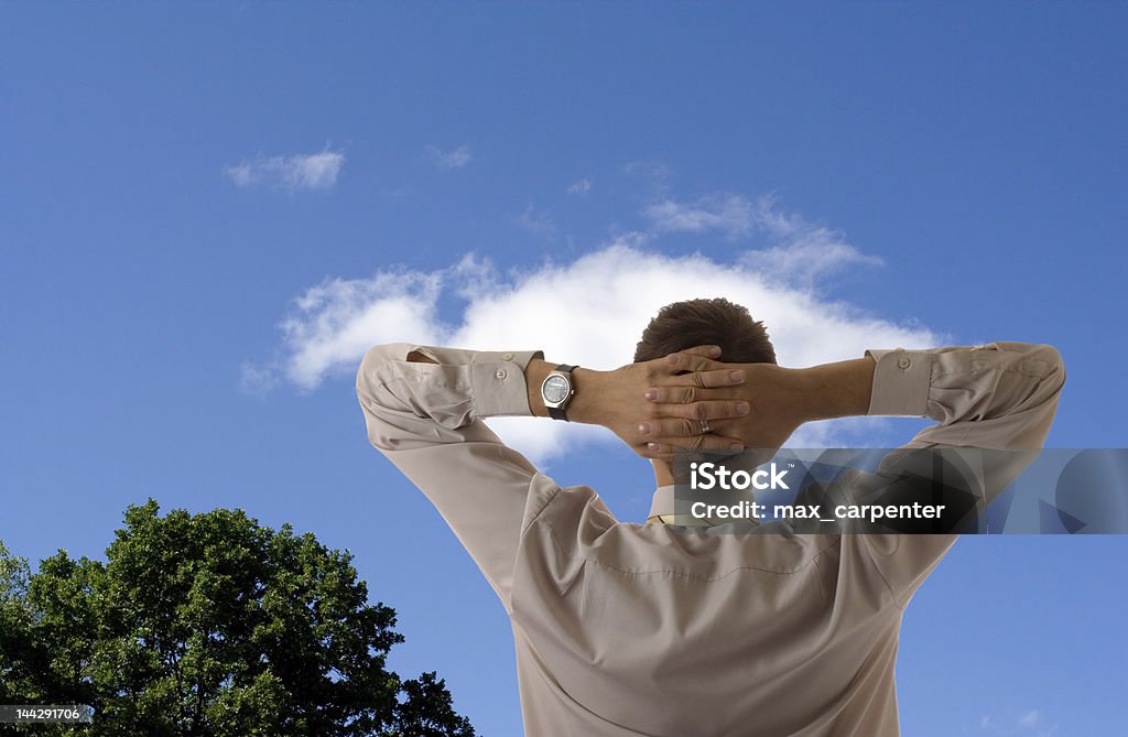 businessman relax blue sky and tree Adult Stock Photo