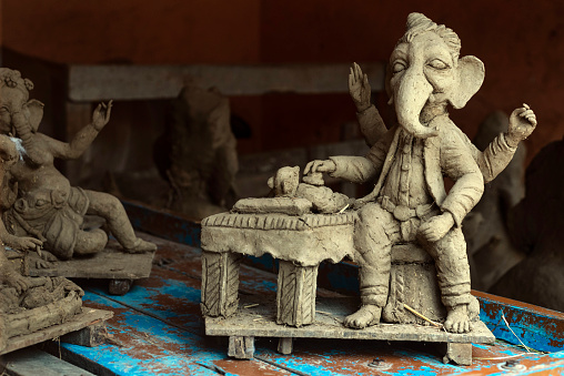 A selective closeup of an Indian deity statue