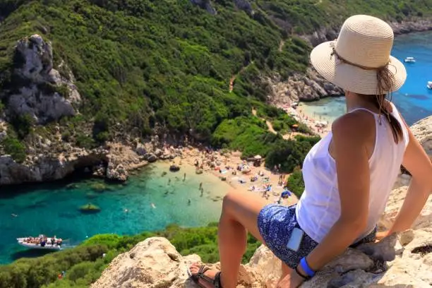 Photo of Girl and Aerial view of Porto Timoni, Afionas region, Corfu, Greece.