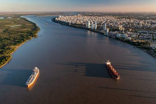 Aerial Shot over  Parana River in front of Rosario City where can see Ships