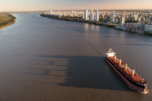 Aerial Shot over  Parana River in front of Rosario City where can see Ships