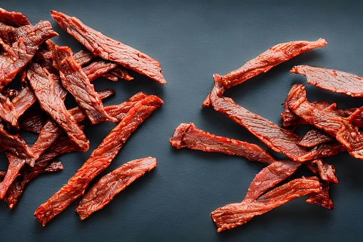 A closeup shot of juicy Beef Jerky on the table