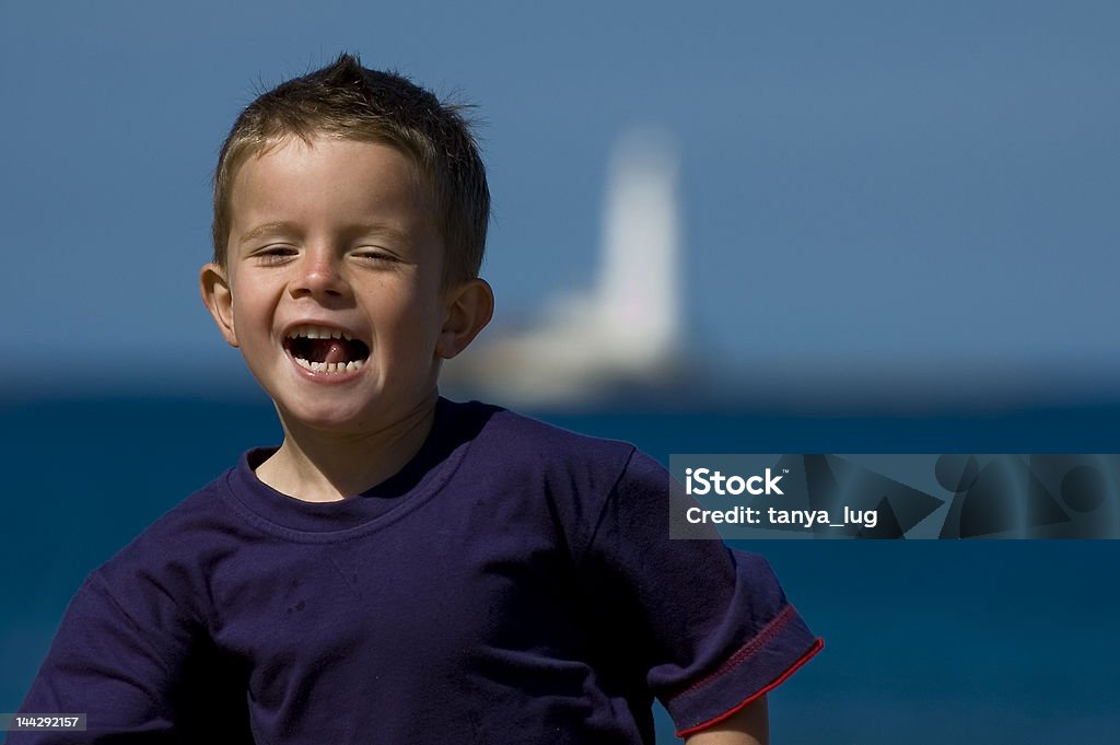 Blue Boy Happy boy at the beach. 4-5 Years Stock Photo