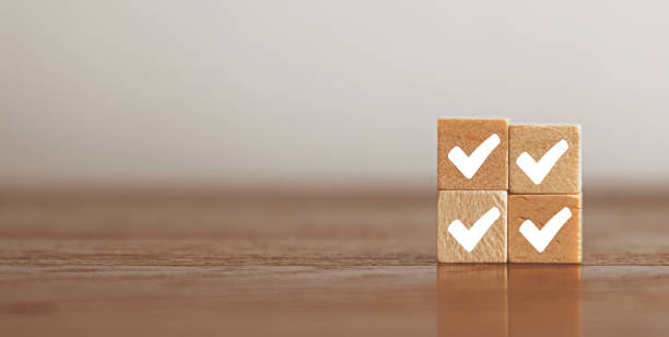 istock Woods block square with correct. ISO certification, Guarantee, Quality assurance, Standards and standardization concept. Customer service evaluation and satisfaction. 1442923896