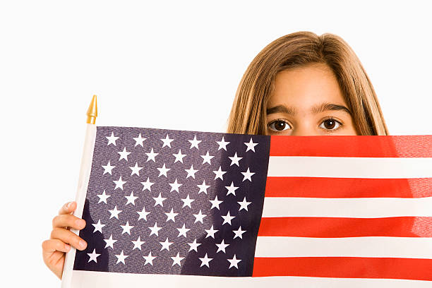 istock Girl holding American flag. 144292433