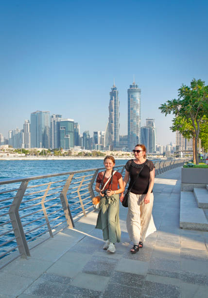 istock Tourists walking at Dubai canal 1442926259