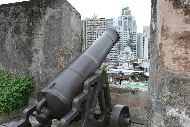 istock Old cannon toward a new city, Macau, China 144292712