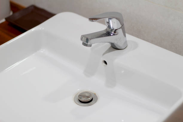 istock White sink with gray faucet 1442927316