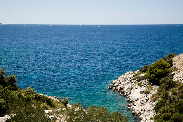 Summer In Croatia, Blue Sky, Clean Sea And Rocks stock photo