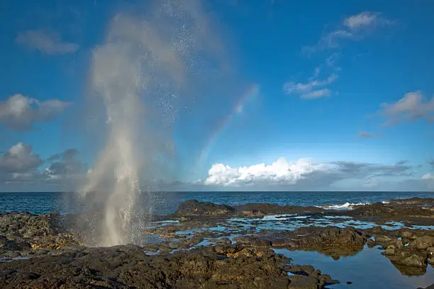 Spouting Horn on Kauai spouting with a rainbow