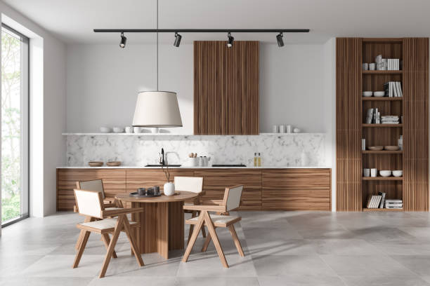 istock Cozy kitchen interior with eating table and seats, shelf and panoramic window 1442930169