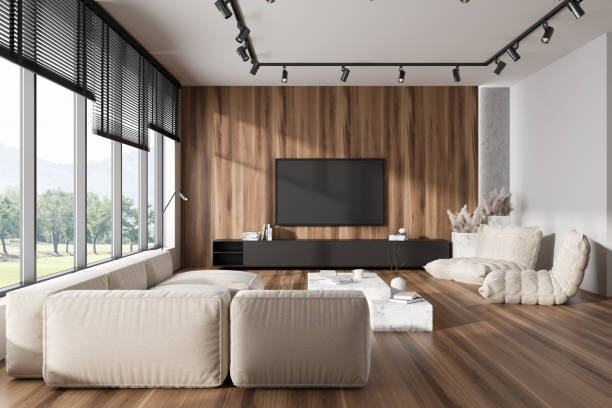 istock Light relaxing interior with couch, drawer and tv screen, panoramic window 1442931359
