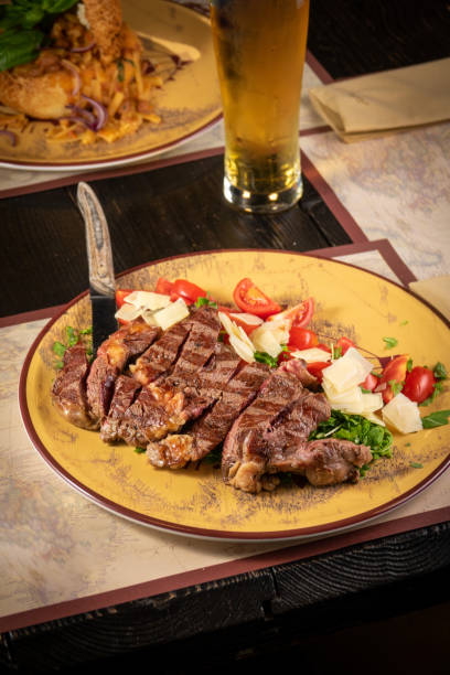 istock Plate of beef on the table with beer 1442931446