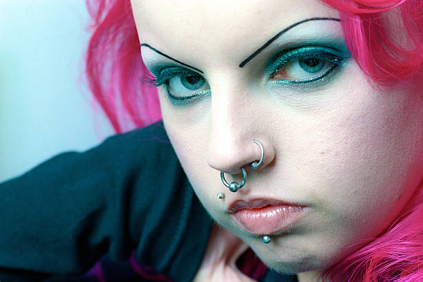 istock Pink haired peirced woman closeup 144293169