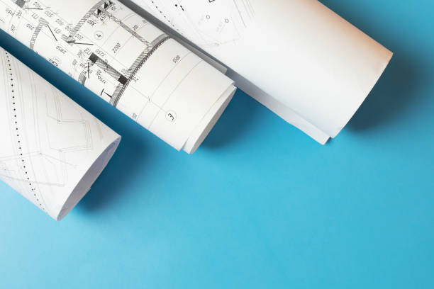 istock Town planning, architect plans urban development, construction drawings on a blue background, copy space 1442932382