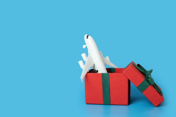 istock plane tickets gift for the holiday, airplane in a gift box 1442932395