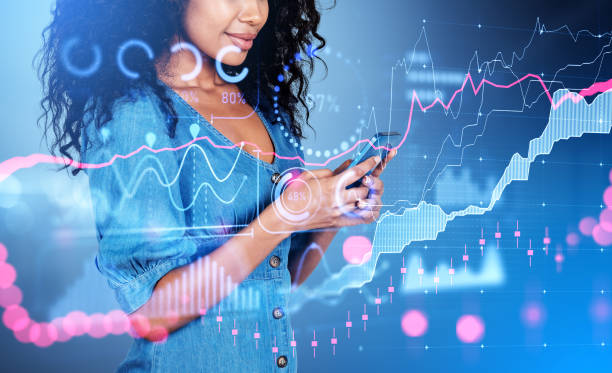 istock African businesswoman using phone, forex chart with global financial statistics 1442932677