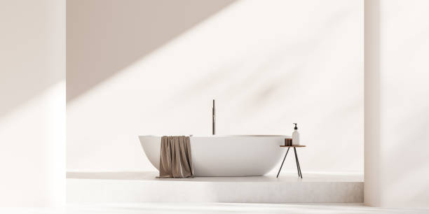 istock Light bathroom interior with bathtub on podium. Copy space 1442933659