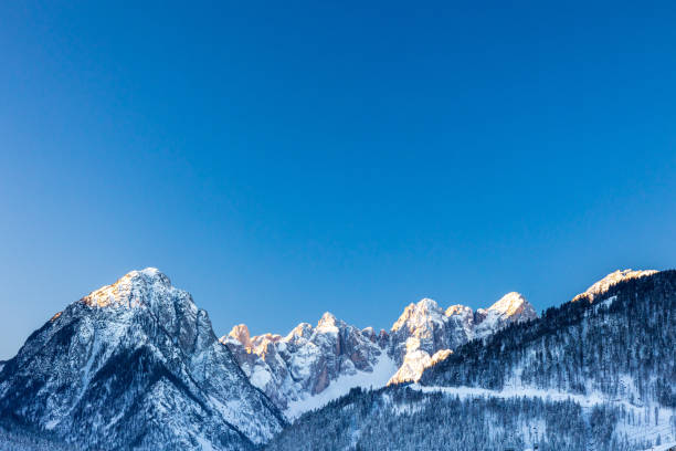 Cold morning in the heart of Julian Alps Frosty winter sunrise in Tarvisio, Friuli Venezia Giulia, Italy julian alps stock pictures, royalty-free photos & images