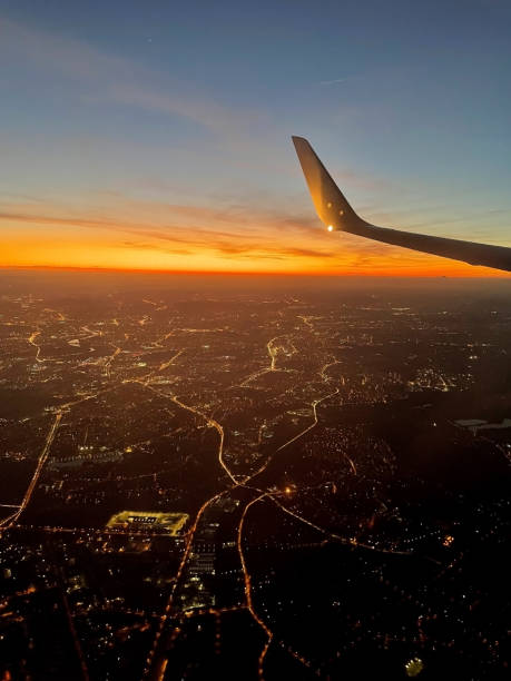 sunset, view from the airplane window - wing airplane window sunset imagens e fotografias de stock