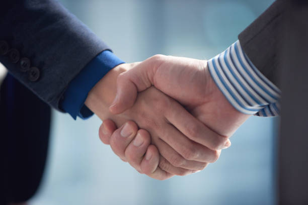 istock Handshaking with business partner 1442936994