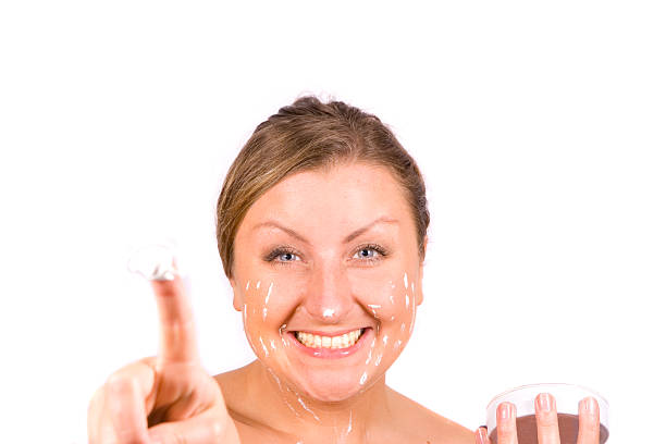 Smiling woman with her favourite cream stock photo