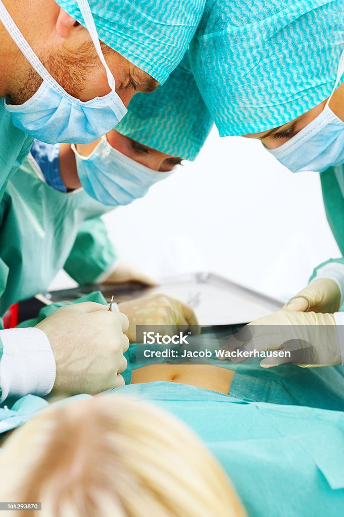 Medical team about to start surgery on a patient Medical team about to start surgery on a patient. Accidents and Disasters Stock Photo