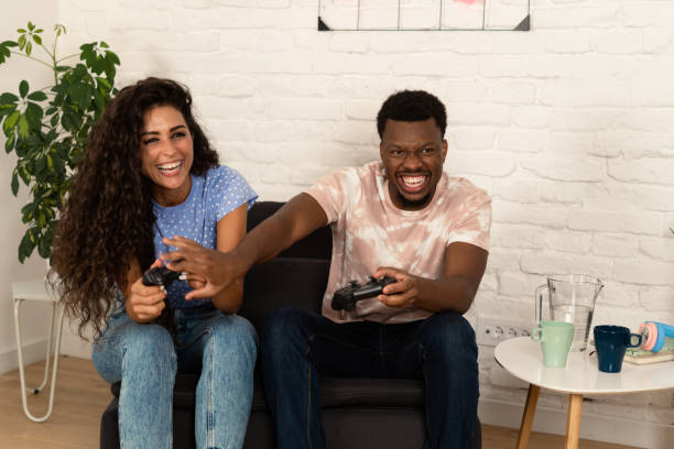 istock Happy multiracial couple competing in gaming 1442940277