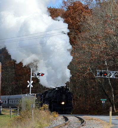 Impressive steam locomotive crossing a road in Eastern USA.
