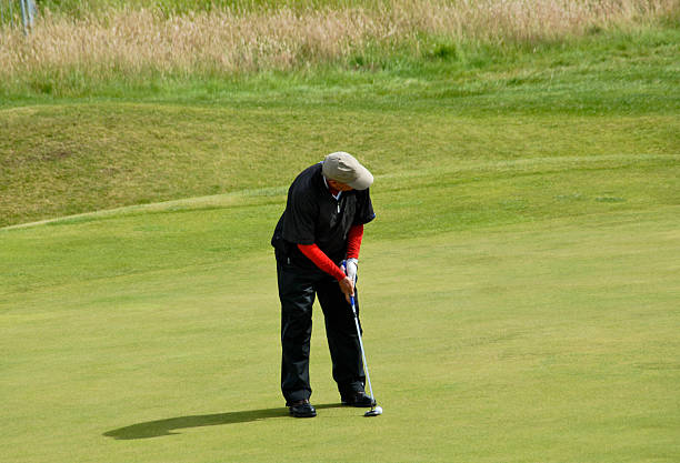 istock Golfer in the action of putting 144294195