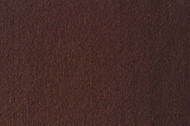 istock Brown color felt textile fabric material texture background. Abstract monochrome dark brown color background 1442942063