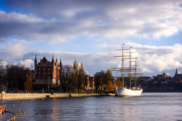 Skeppsholmen island in Stockholm, Sweden with sailboat af Chapman moored on a bright sunny day in the fall