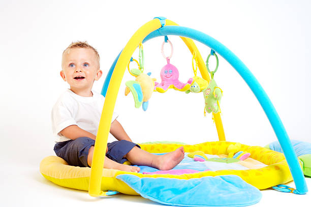 istock Baby plays with toys 144294446