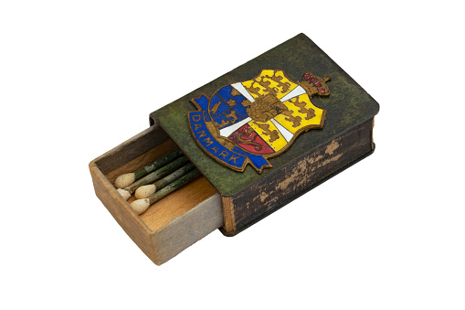 old matchbox with emblem of Denmark on white background