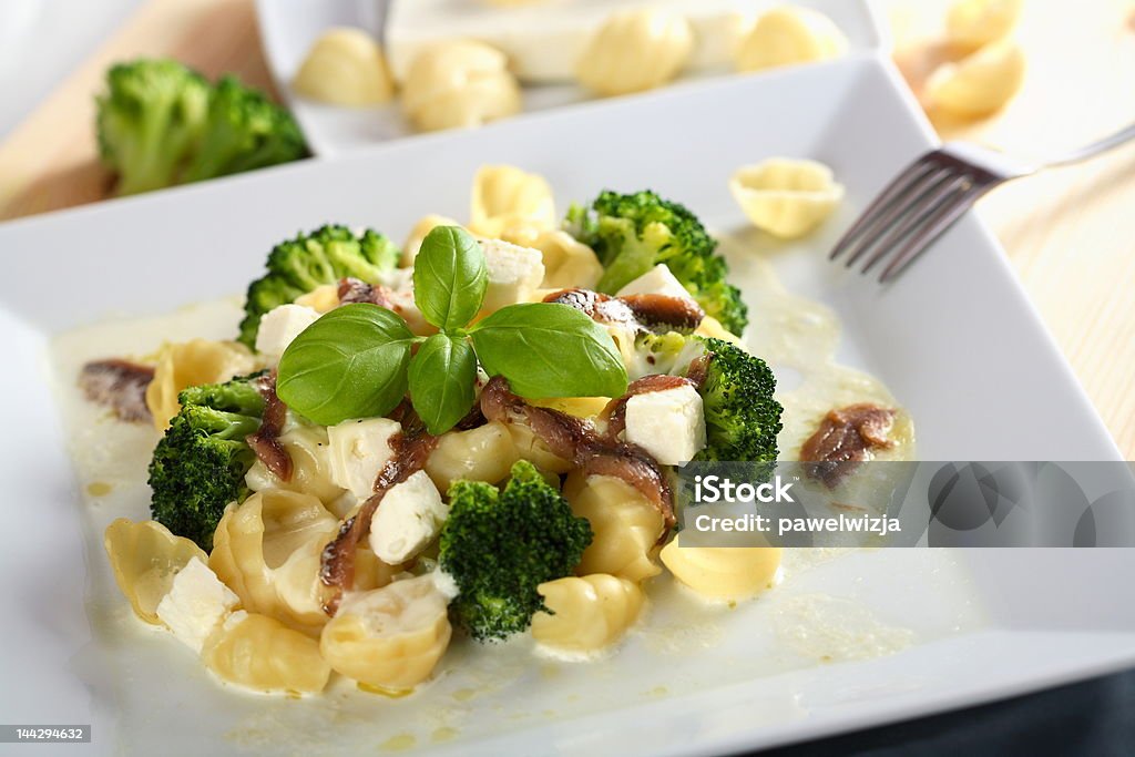 Oven broccoli with anchovy Oven broccoli with anchovy on the plate Anchovy Stock Photo