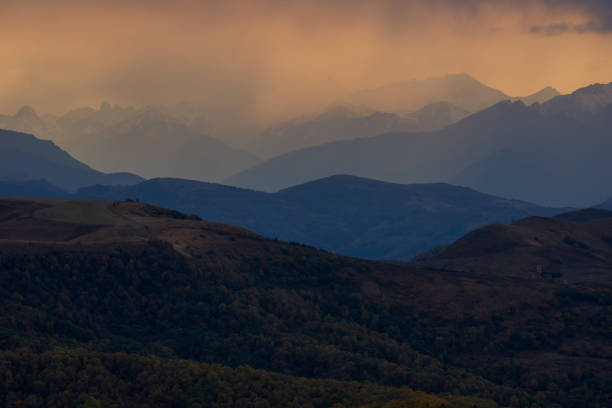 Great sunset with a view on mountain ridge and valley from Gumbashi mountain pass, Elbrus region, Russia